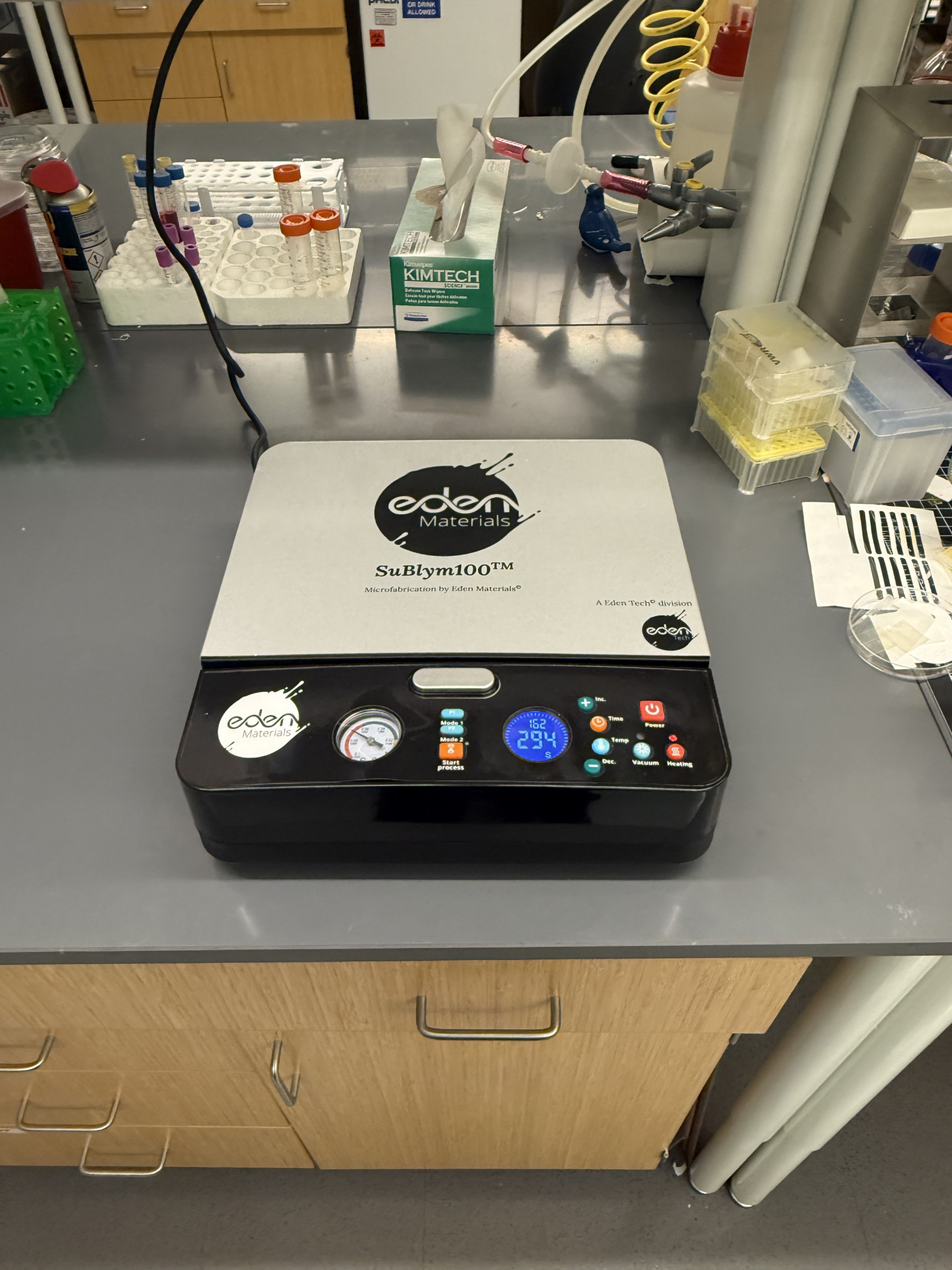 Sublym hot embossing machine installed on lab bench at Emory University